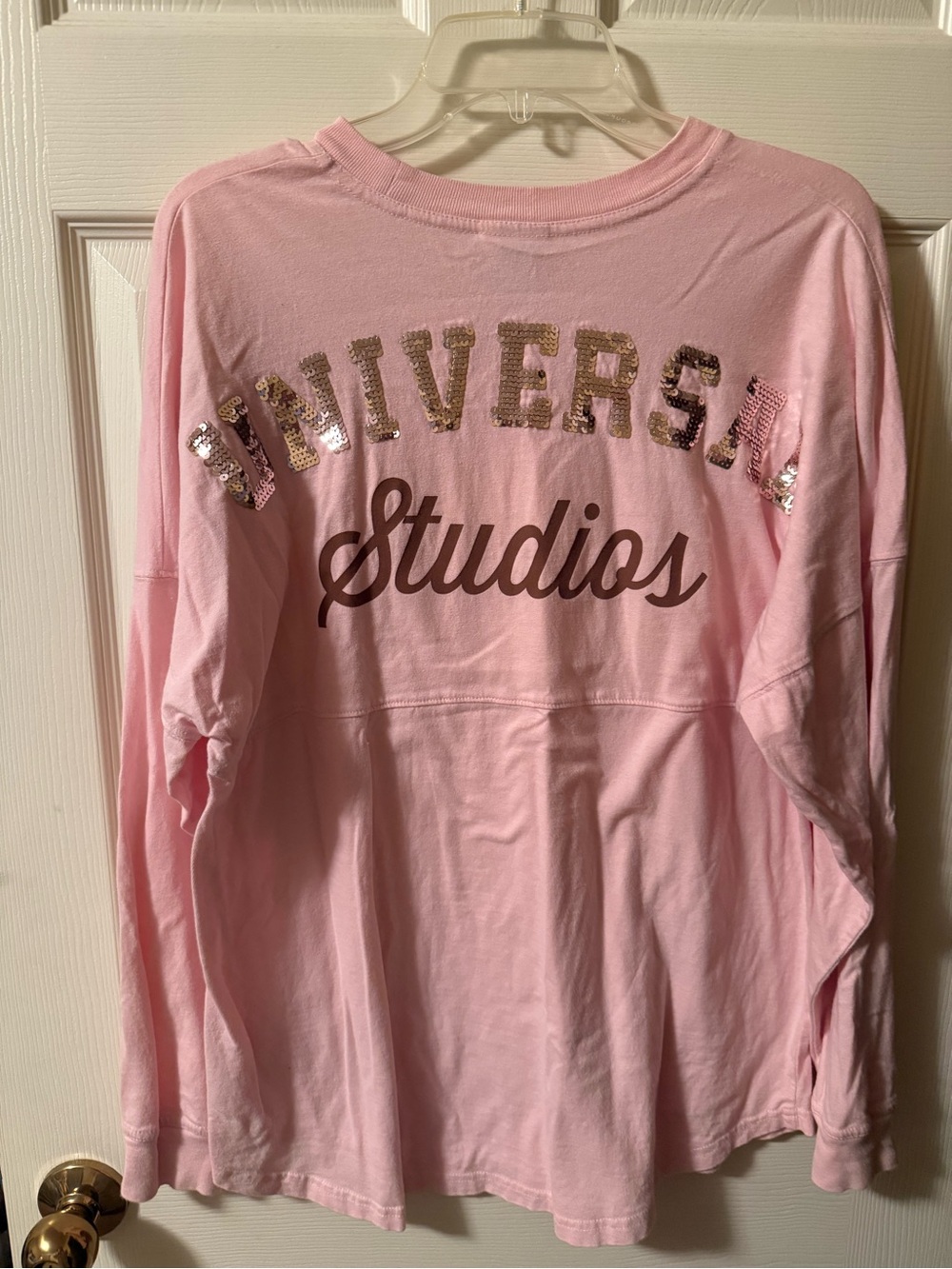 Universal Pink Long Sleeve Top with Sequin 'Universal' and Script 'Studios'